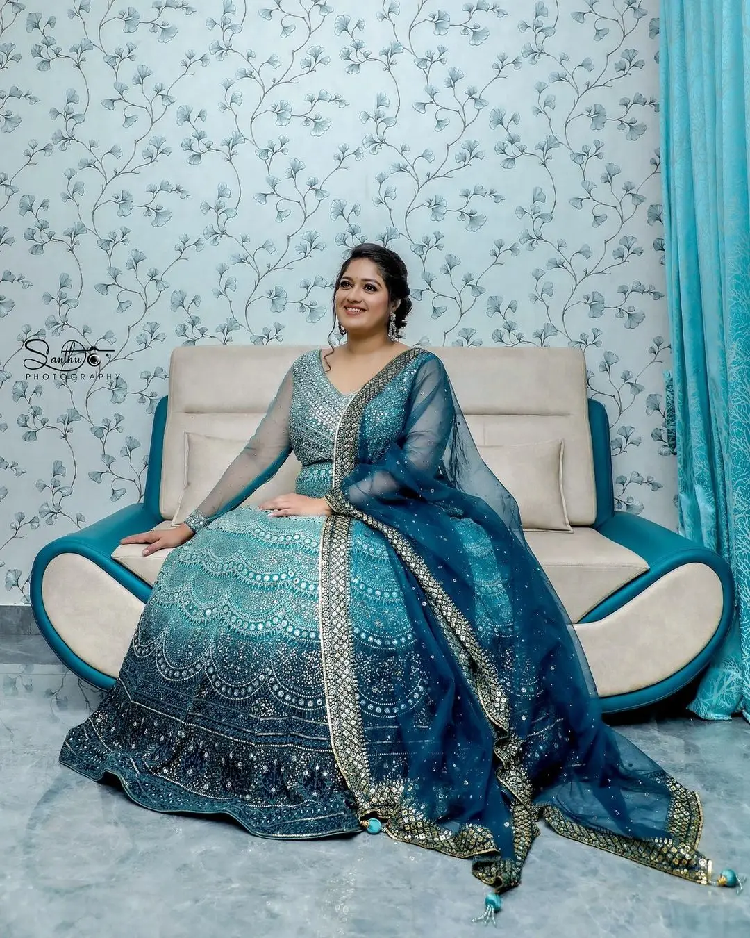 Actress Meghana Raj Stills in Beautiful Blue Designer Gown